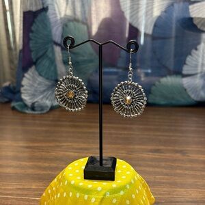 Elegant Silver Tone Sunburst Earrings with Yellow Stones